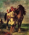 Ferdinand Victor Eugene Un marroquí ensillando un caballo Romántico Eugene Delacroix